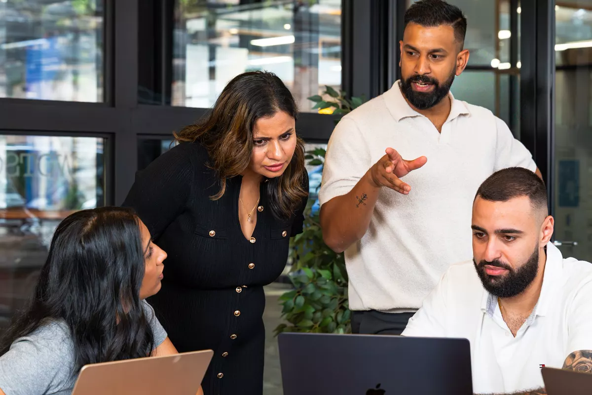 The InvestorMate team reviewing a property together at a laptop